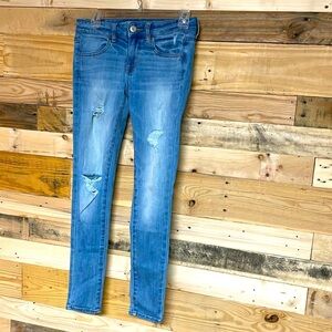 American Eagle size 2 regular low-rise light wash super stretch distress jegging